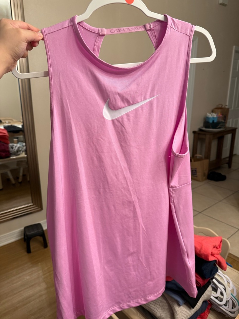 Nike Women’s Light Pink Sleeveless Training Tank with White Swoosh